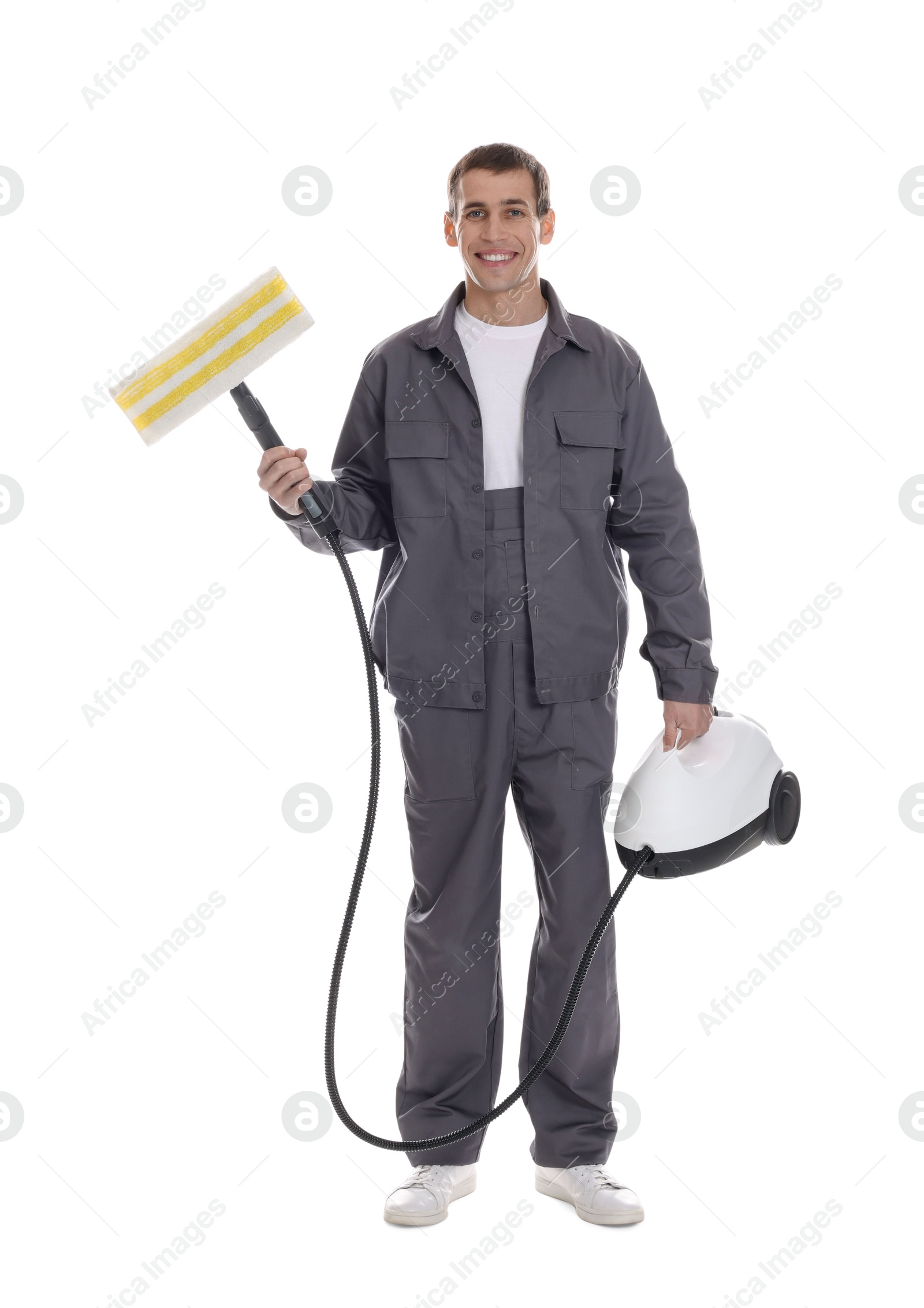 Photo of Smiling cleaning service worker with steam cleaner on white background