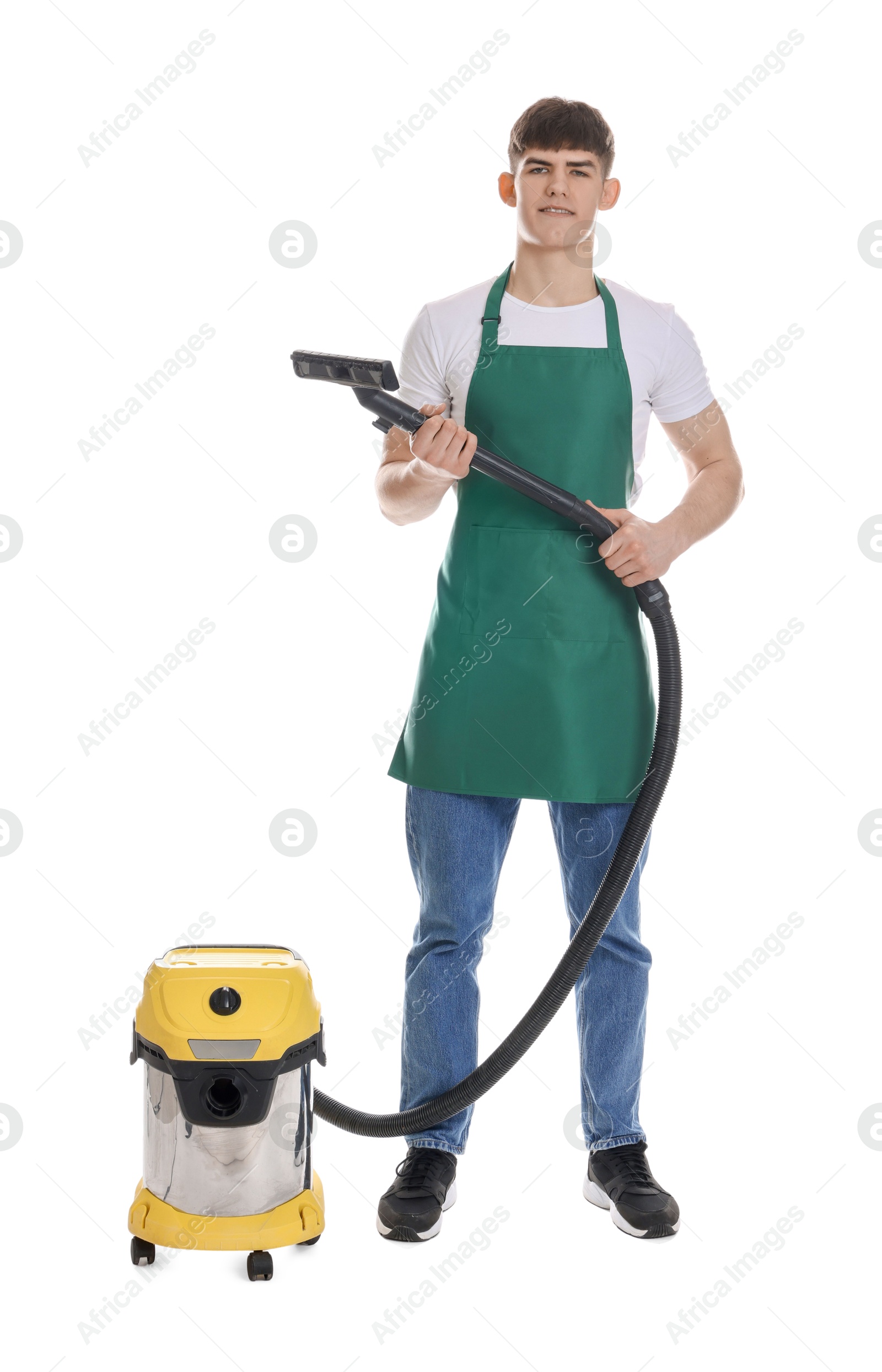 Photo of Smiling cleaning service worker with vacuum cleaner on white background