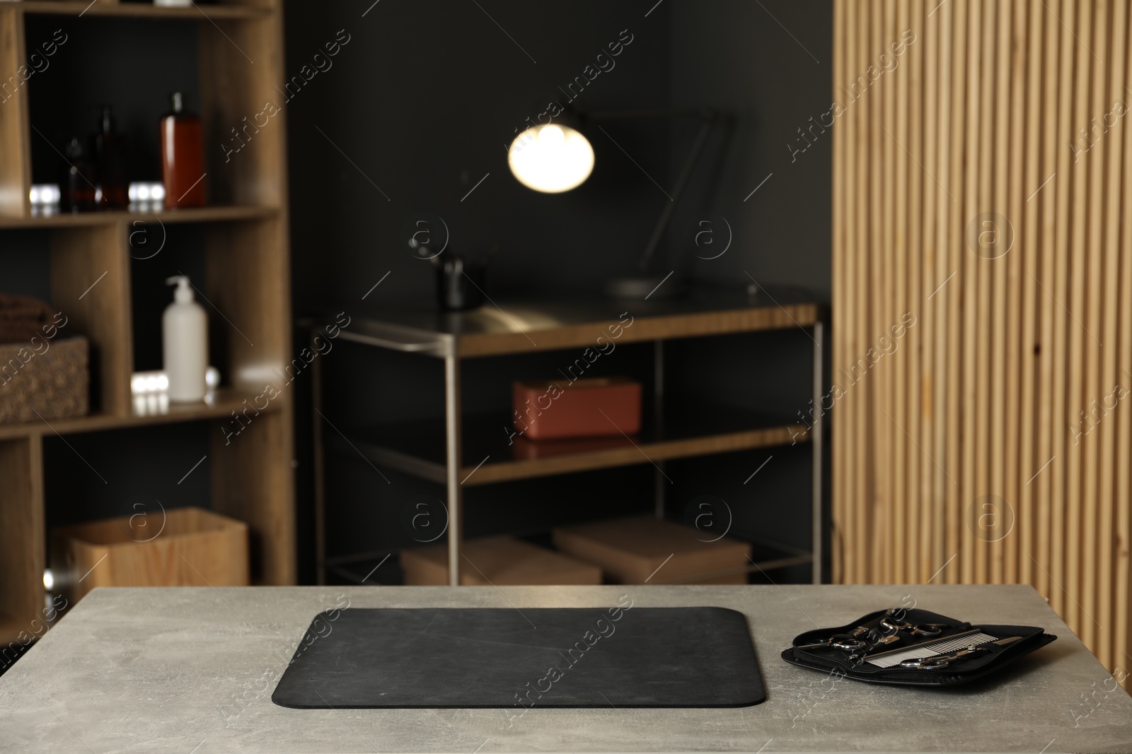 Photo of Empty groomer's salon with tools and cosmetic products