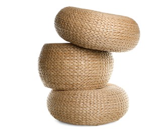 Photo of Three stylish wicker poufs on white background