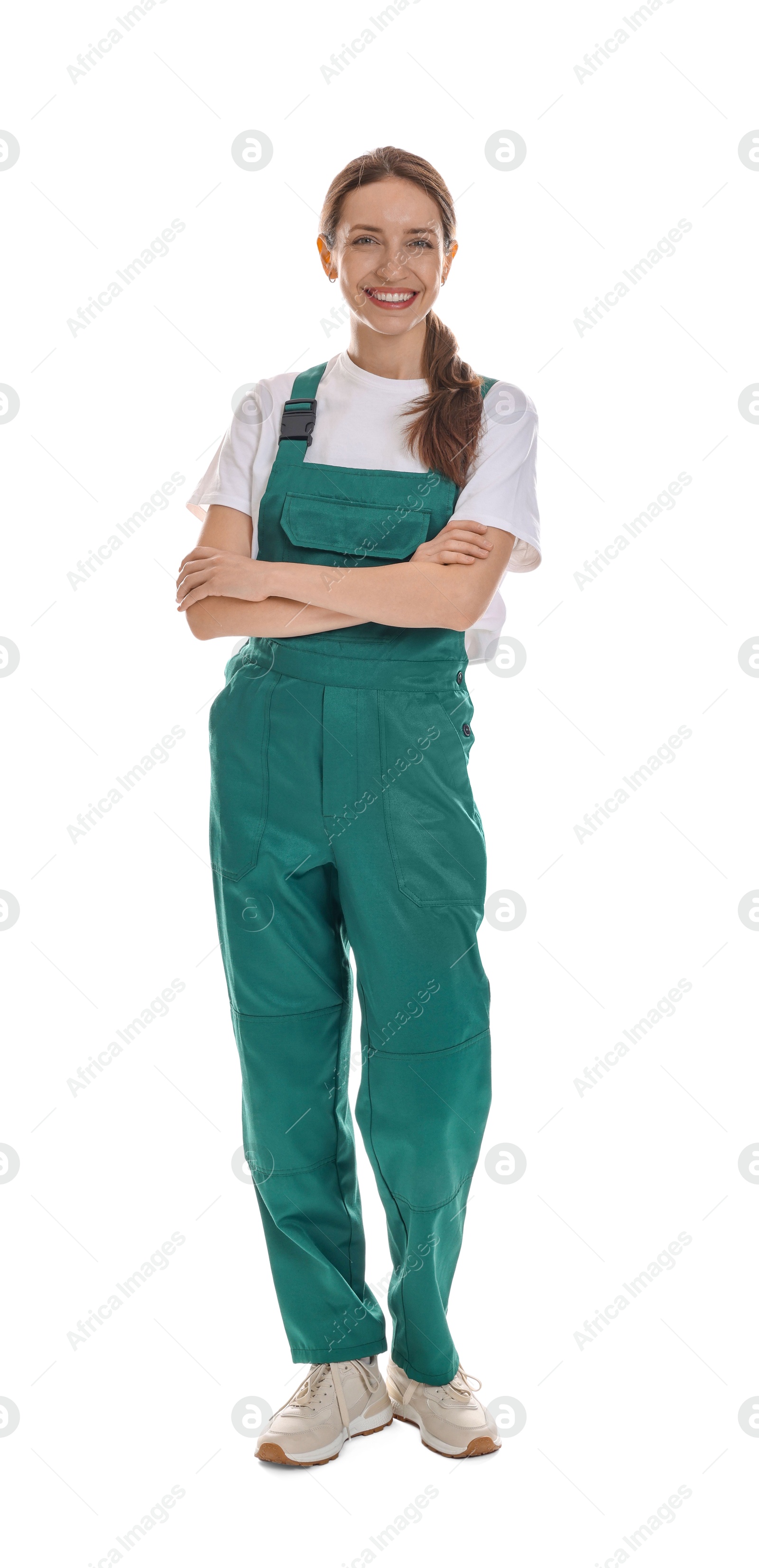 Photo of Smiling cleaning service worker with crossed arms on white background