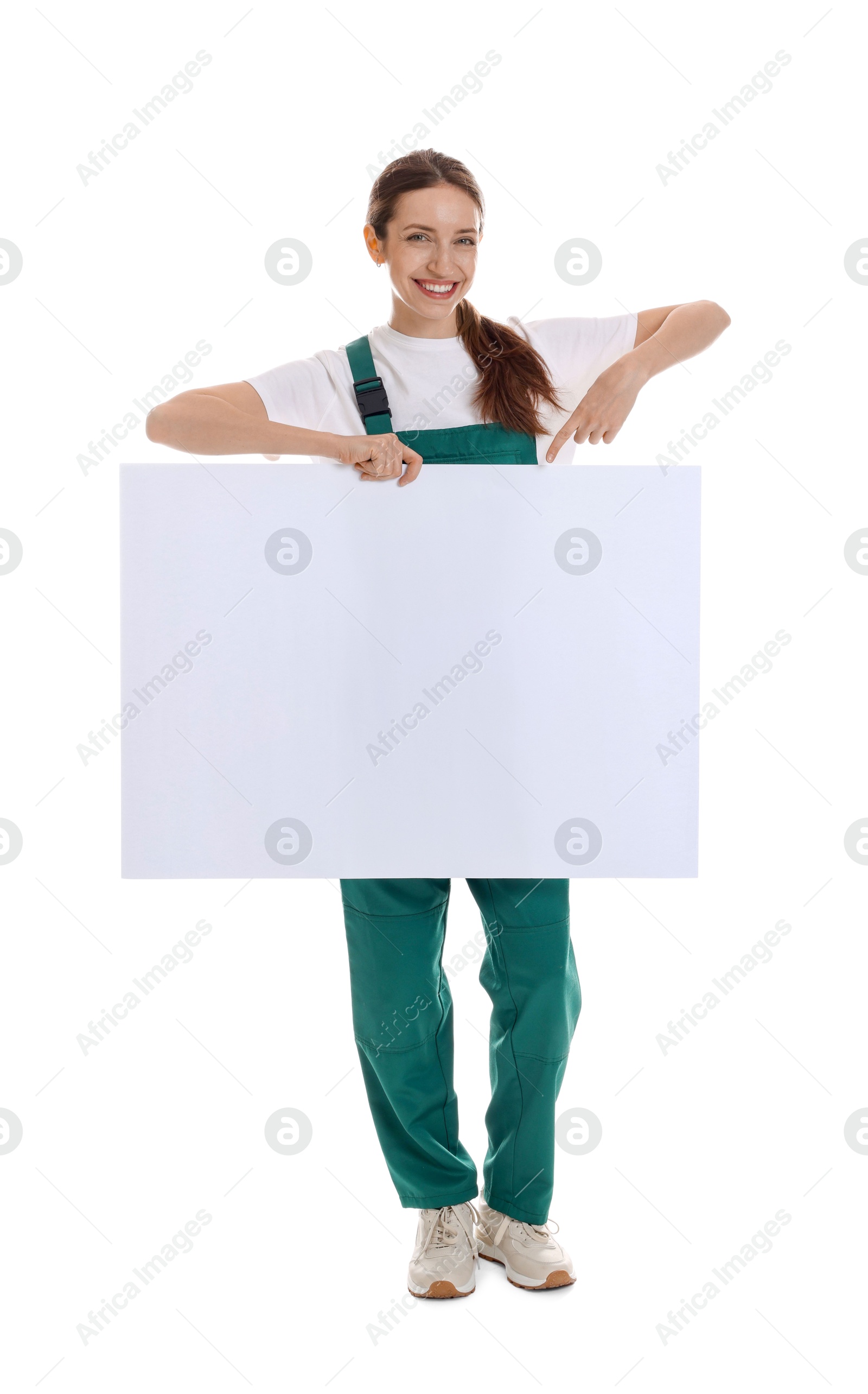 Photo of Smiling cleaning service worker with sheet of paper on white background. Space for text