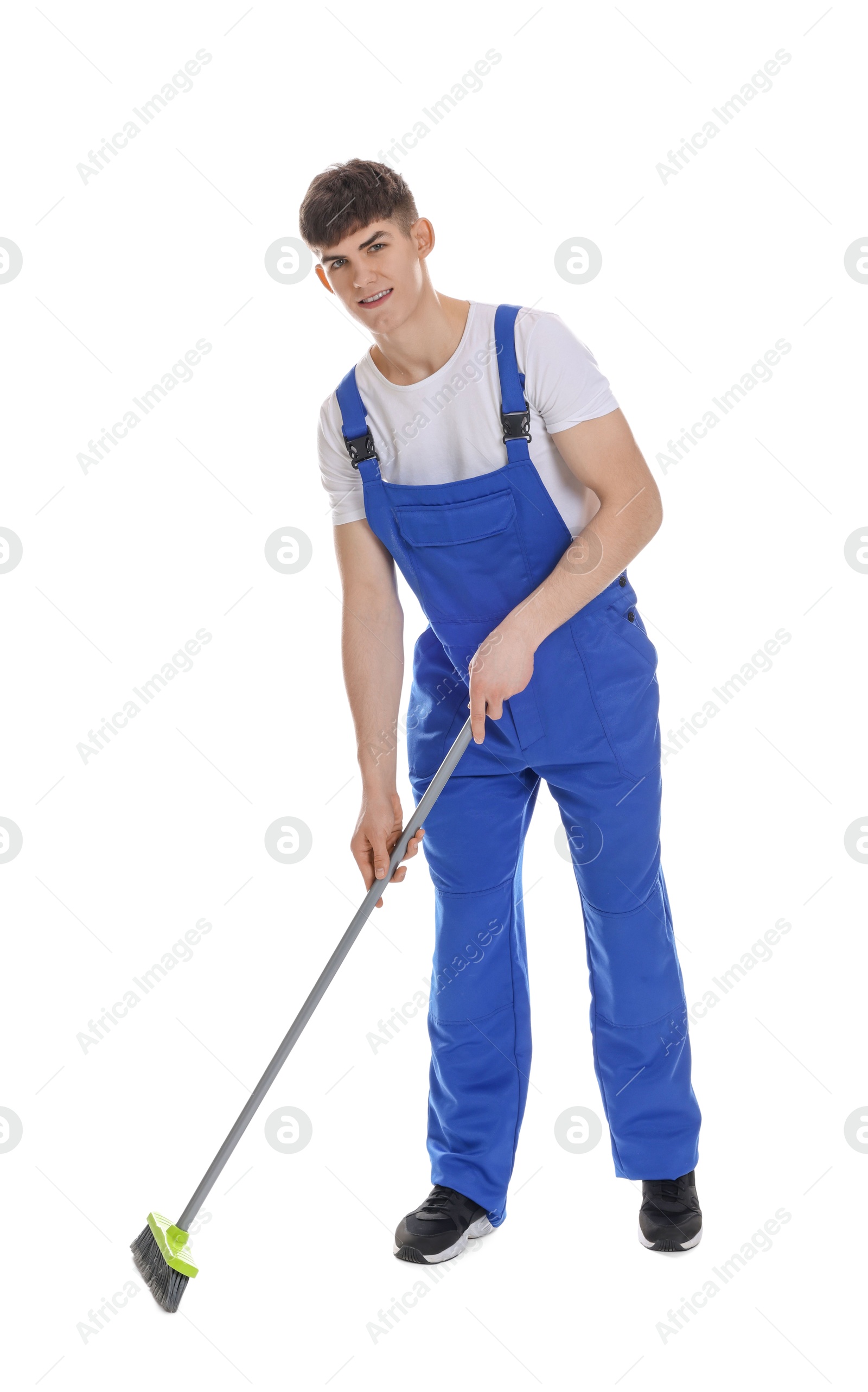 Photo of Smiling cleaning service worker with broom on white background