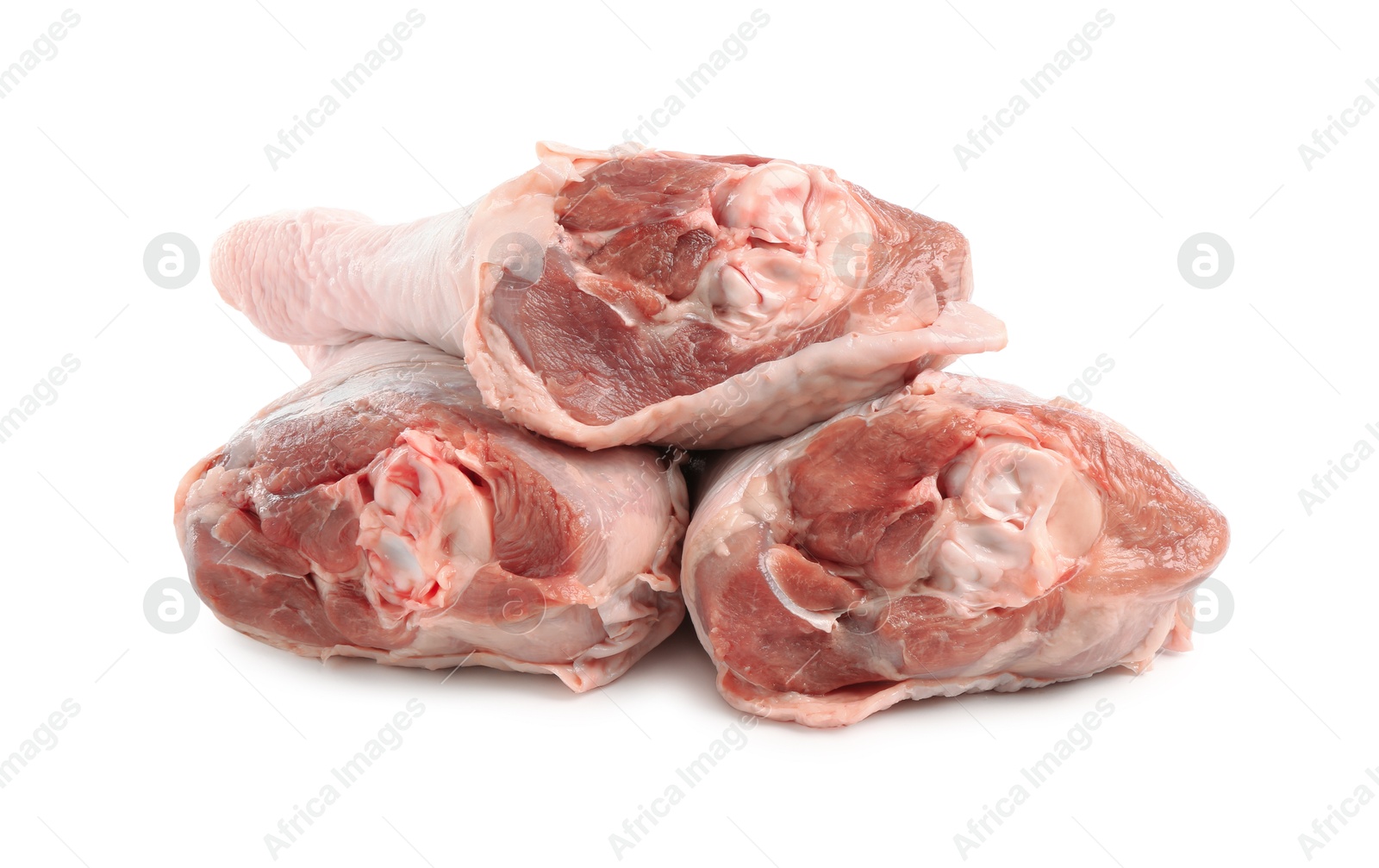 Photo of Three raw turkey drumsticks isolated on white