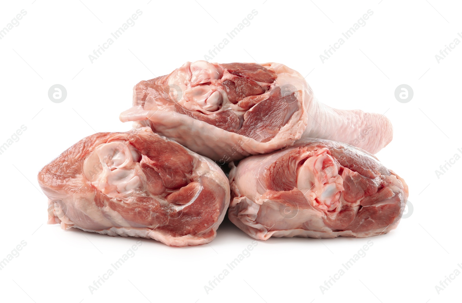 Photo of Three raw turkey drumsticks isolated on white