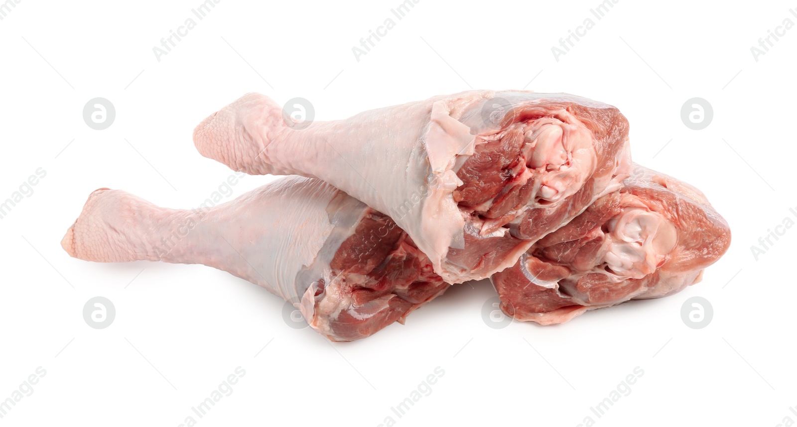 Photo of Three raw turkey drumsticks isolated on white