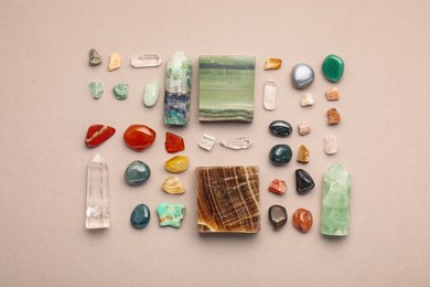 Photo of Different natural gemstones on light background, flat lay