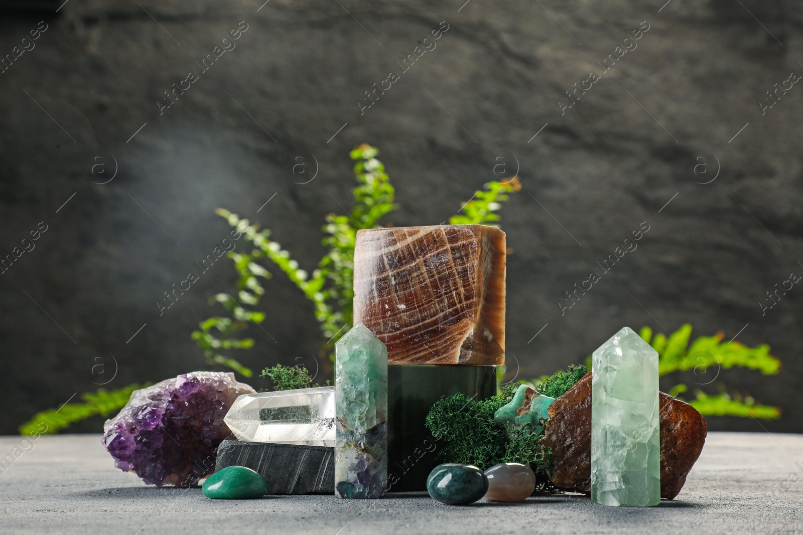 Photo of Natural gemstones and moss on light table