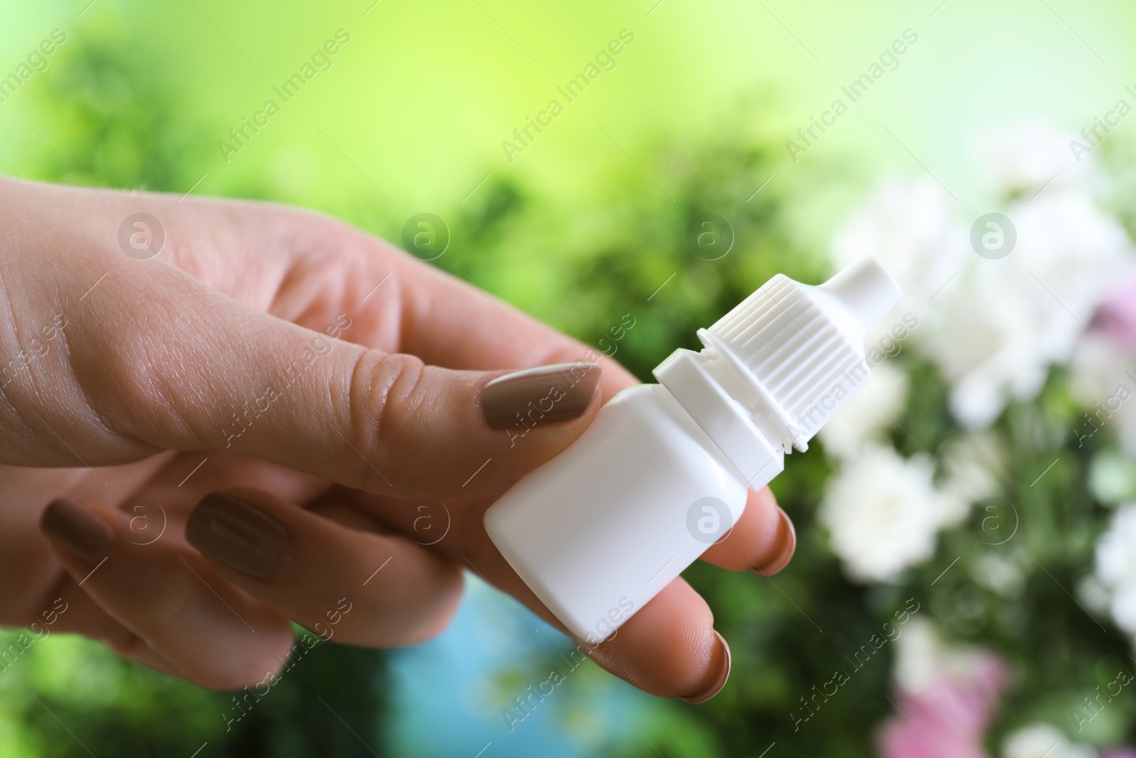 Photo of Allergy treatment. Woman with medical drops on blurred background, closeup