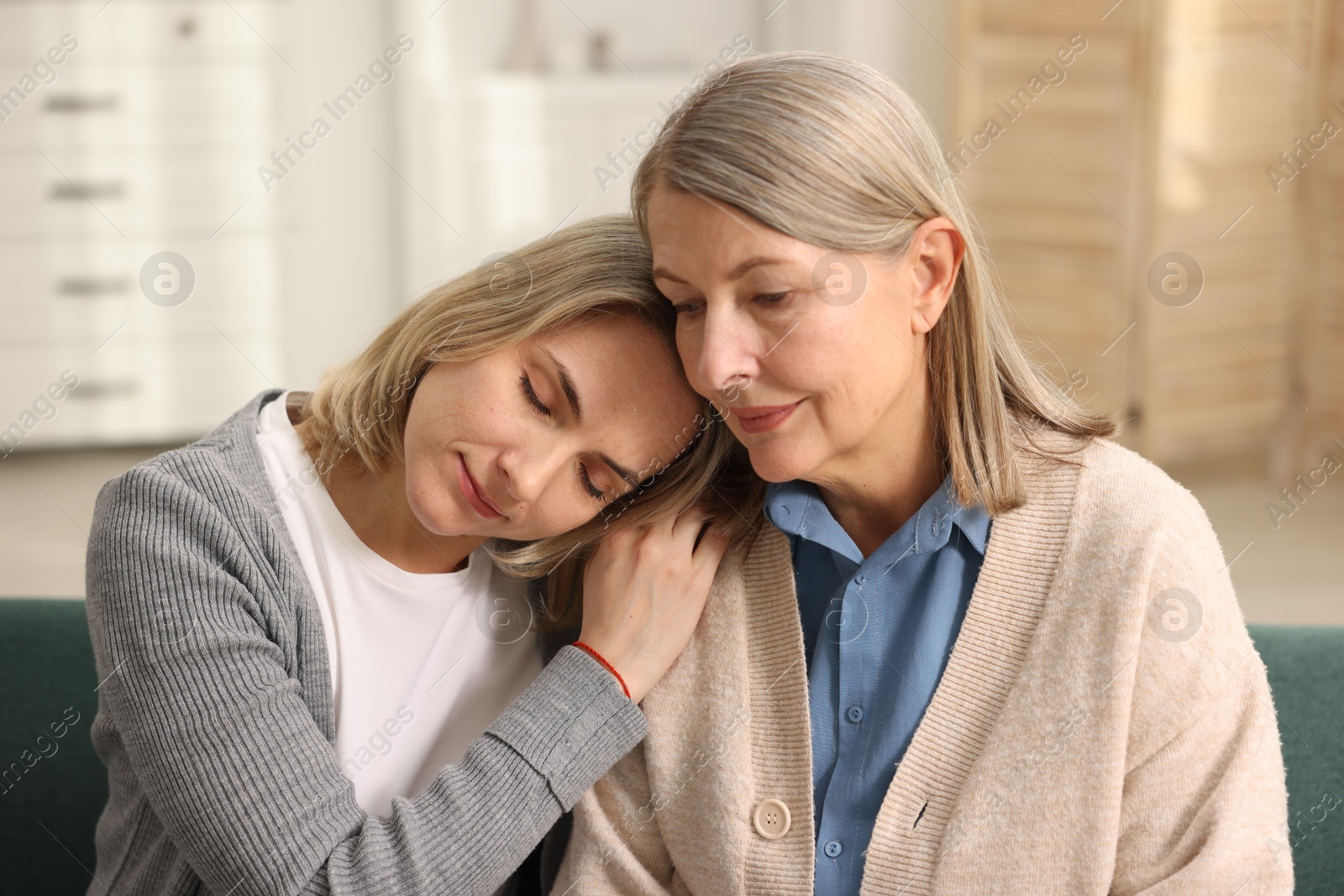 Photo of Daughter and her mother spending time together at home