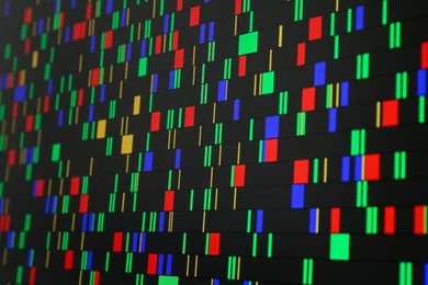 Photo of DNA analysis. Data with genetic information as background, closeup