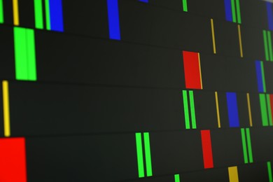 Photo of DNA analysis. Data with genetic information as background, closeup