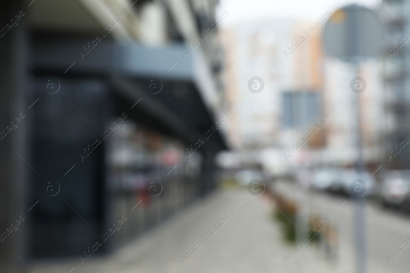 Photo of Blurred view of modern buildings with many windows outdoors