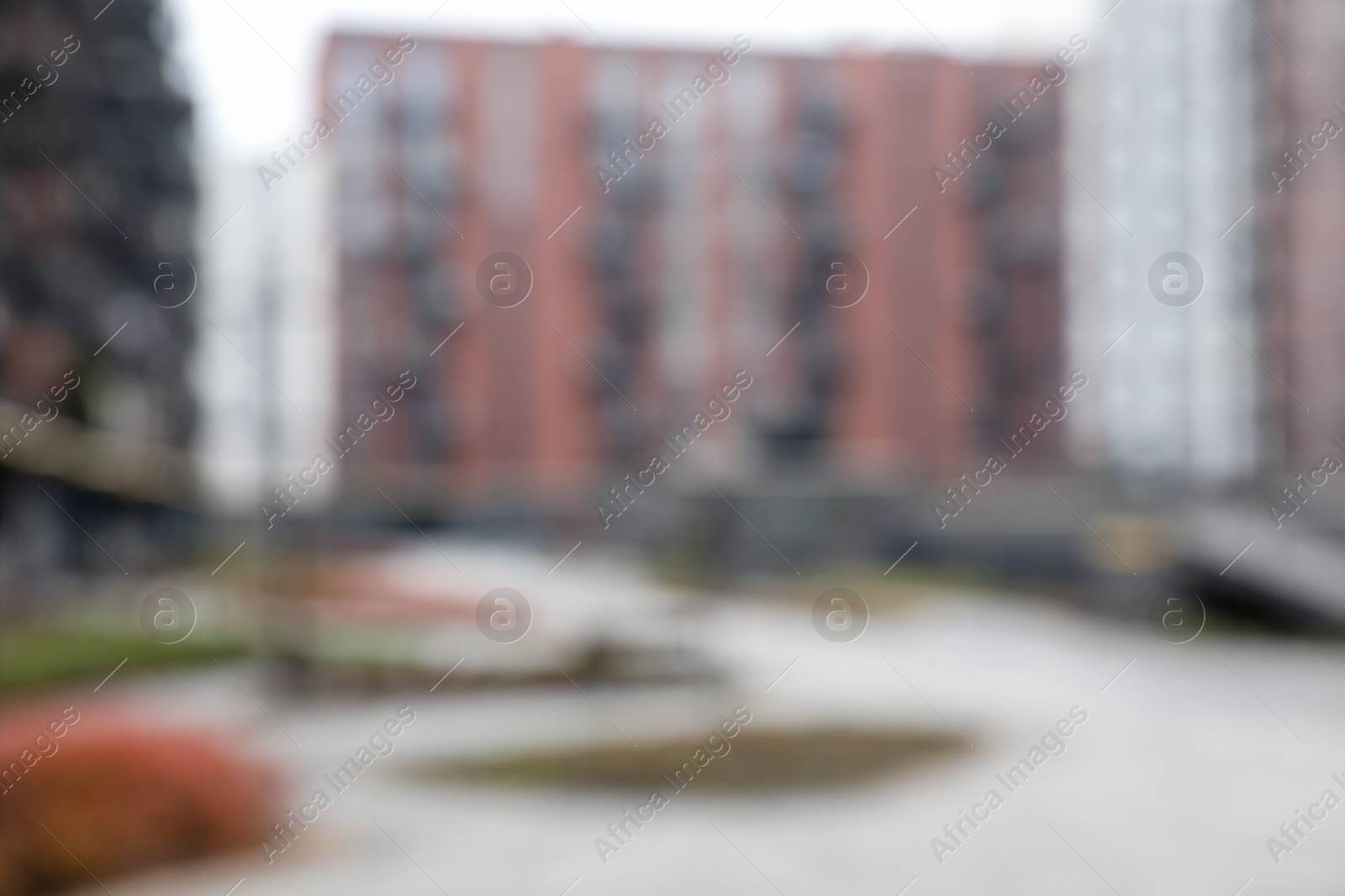 Photo of Blurred view of modern buildings with many windows outdoors