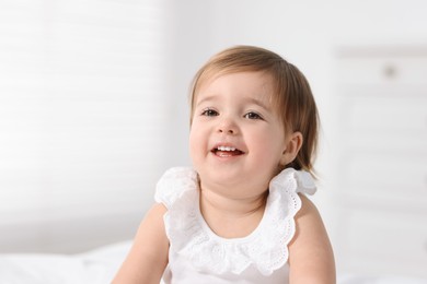 Photo of Portrait of cute little baby girl at home