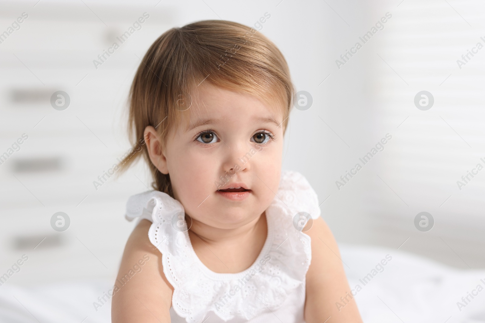 Photo of Portrait of cute little baby girl at home