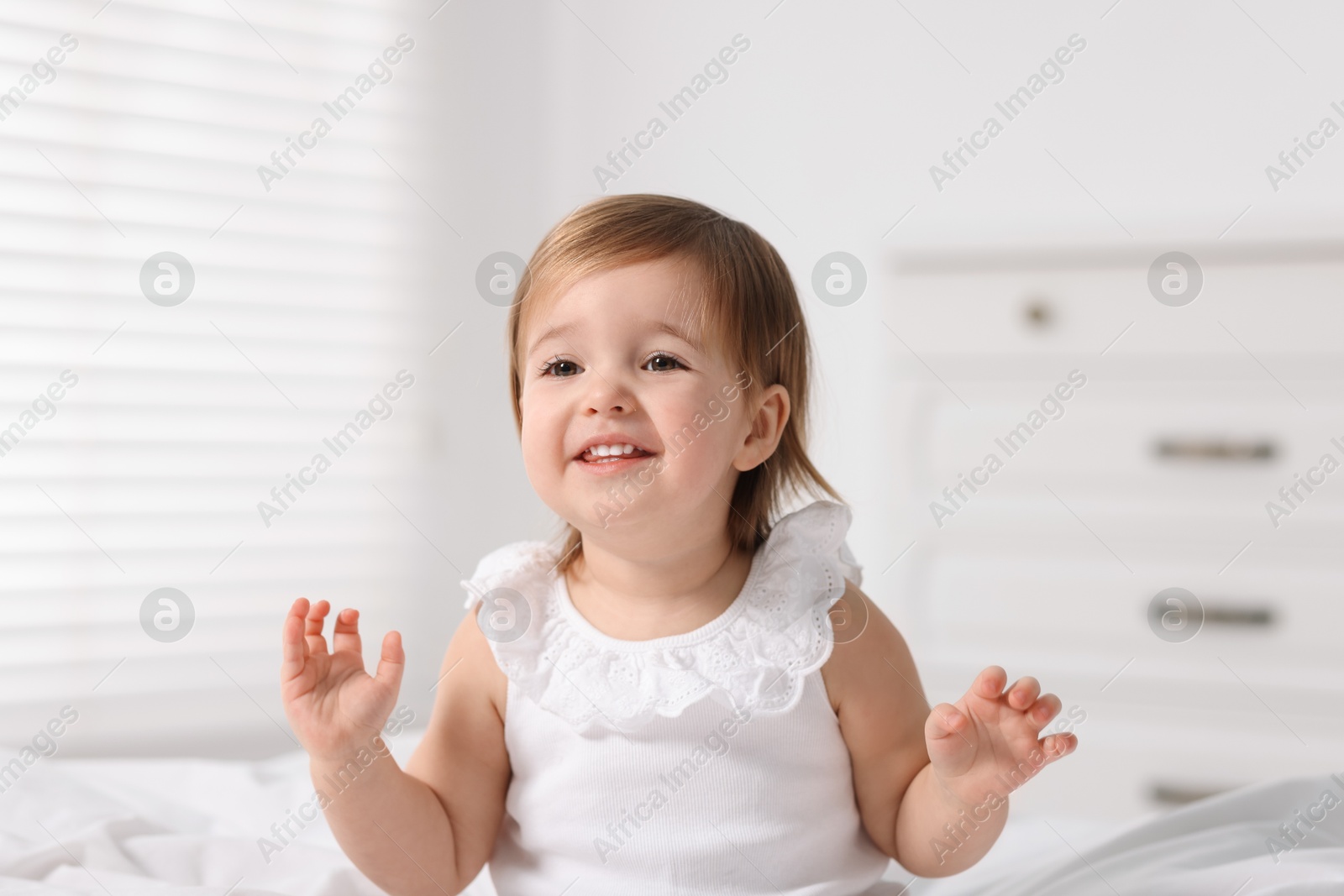 Photo of Portrait of cute little baby girl at home