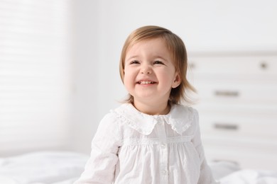 Photo of Portrait of cute little baby girl at home