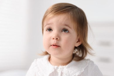 Photo of Portrait of cute little baby girl at home