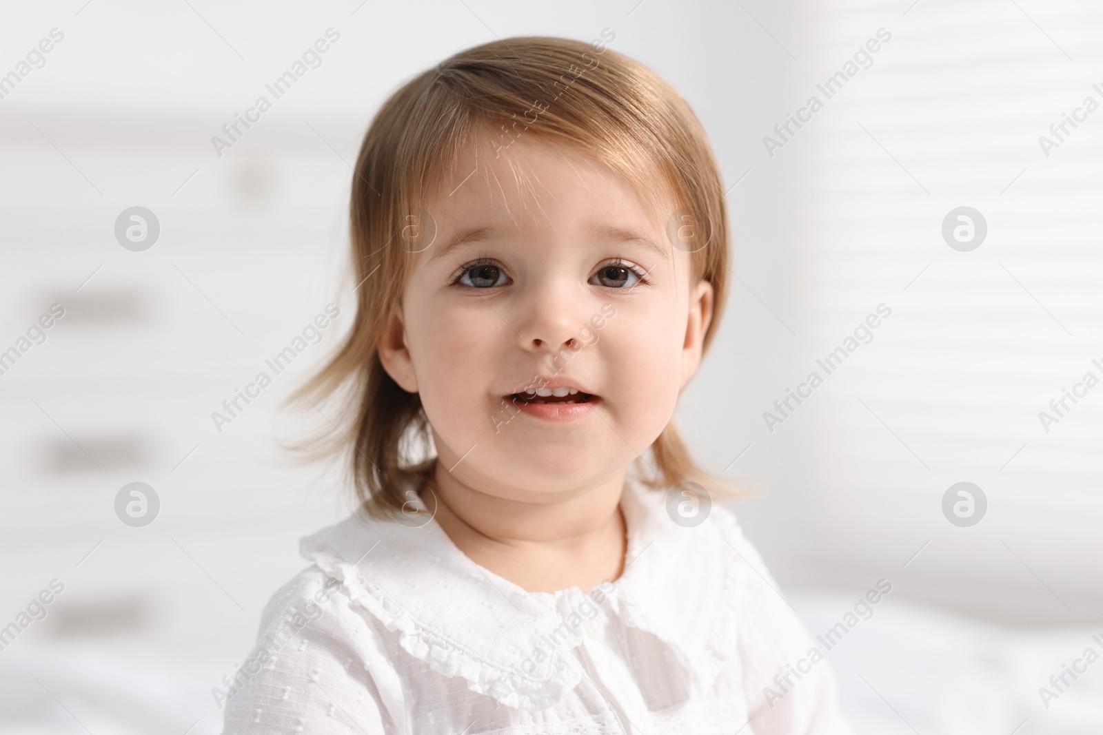 Photo of Portrait of cute little baby girl at home