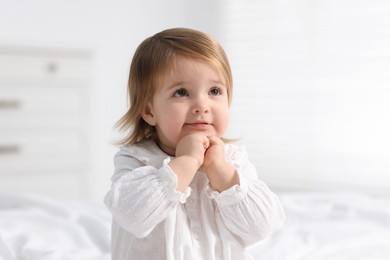 Photo of Portrait of cute little baby girl at home