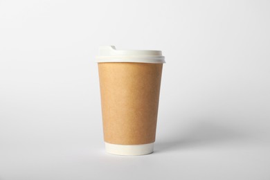 Photo of Paper cup with lid on white background. Mockup for design