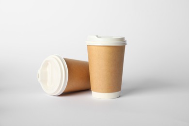 Photo of Paper cups on white background. Mockup for design