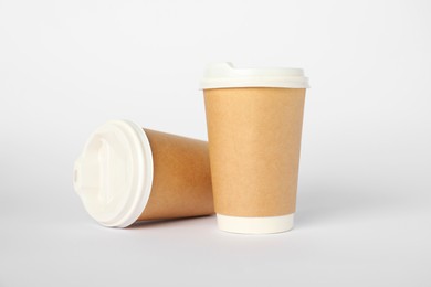 Photo of Paper cups on white background. Mockup for design