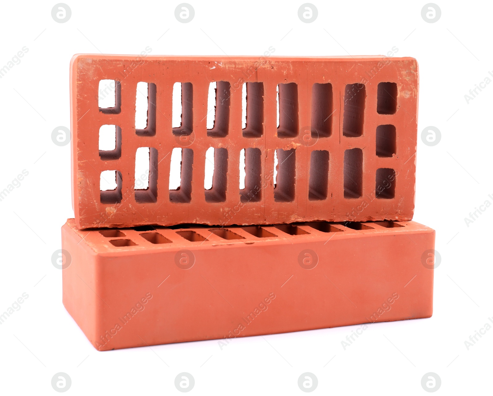 Photo of Red bricks isolated on white. Construction material