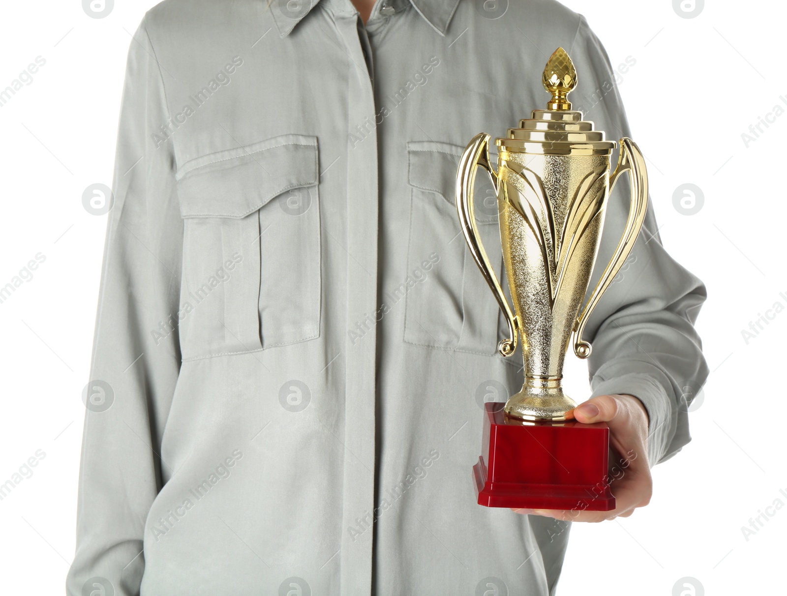 Photo of Woman with golden trophy cup on white background, closeup