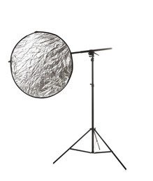 Photo of Stand with light reflector isolated on white. Photo studio equipment