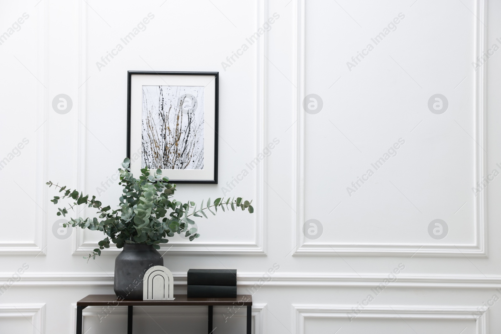 Photo of Console table with decor near white wall in room, space for text. Interior design