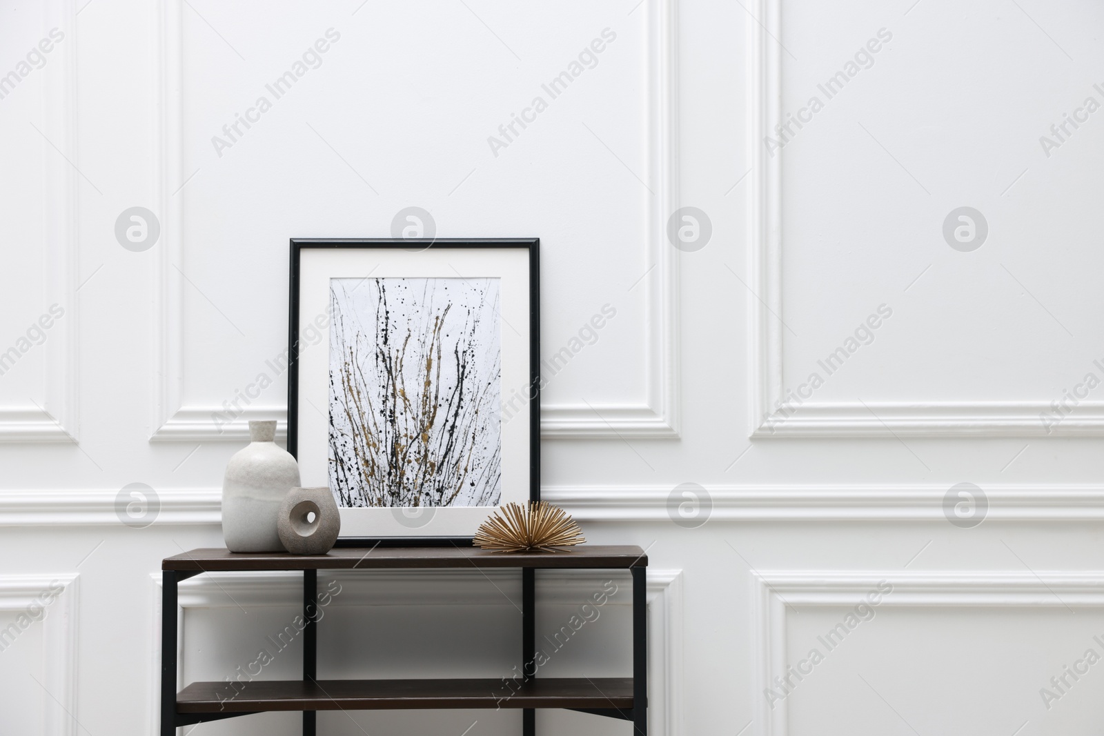 Photo of Console table with decor near white wall in room, space for text. Interior design