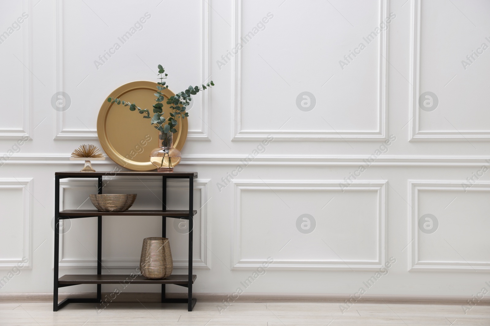 Photo of Console table with decor near white wall in room, space for text. Interior design