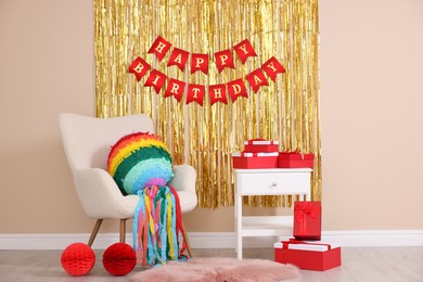 Photo of Colorful pinata and party accessories in festive decorated room