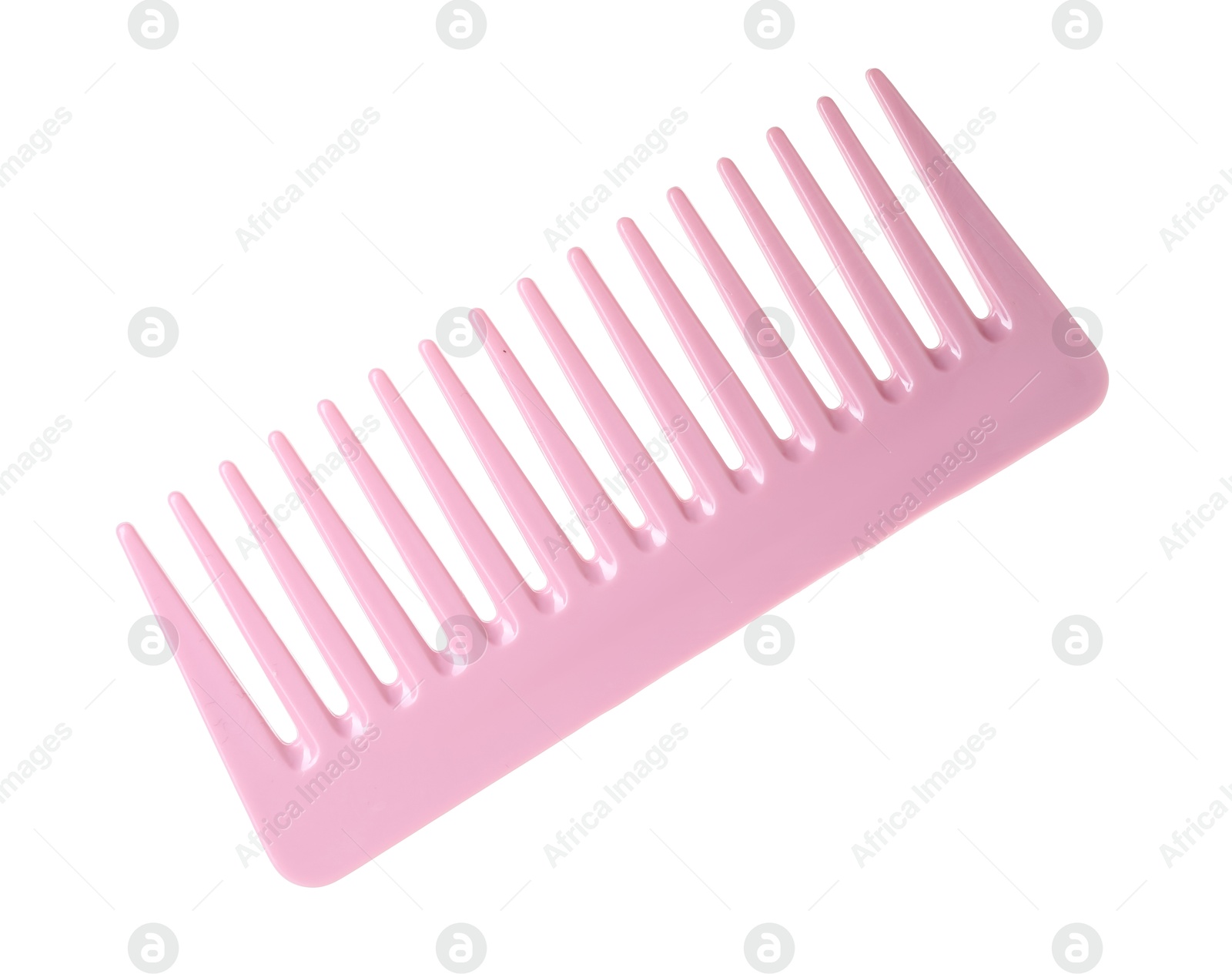 Photo of One pink plastic comb isolated on white