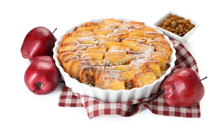 Photo of Delicious bread pudding with raisins, powdered sugar and apples isolated on white