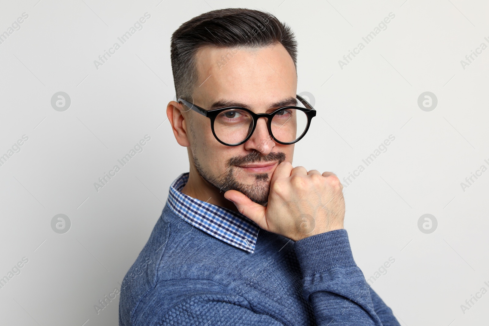 Photo of Portrait of handsome middle aged man on light background