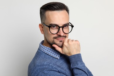 Photo of Portrait of handsome middle aged man on light background