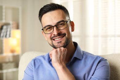 Portrait of handsome middle aged man indoors