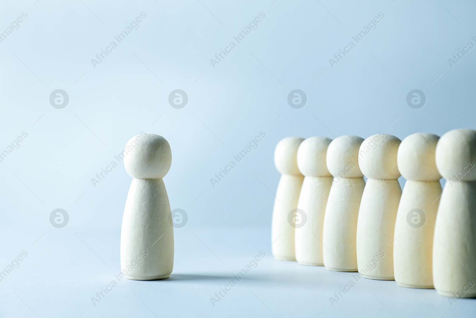 Photo of Human resources concept. Many wooden figures on light background, closeup