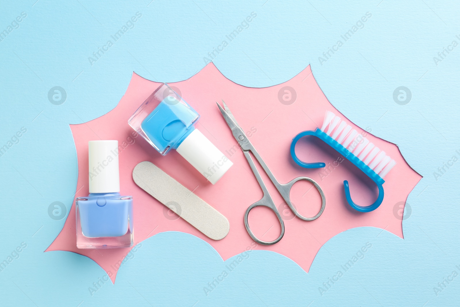 Photo of Set of pedicure tools on color background, flat lay