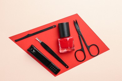 Photo of Set of pedicure tools on color background, flat lay