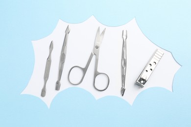 Photo of Set of pedicure tools on color background, flat lay