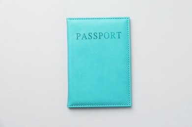 Photo of Passport in bright cover on grey background, top view