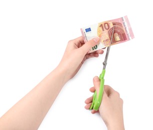 Photo of Woman cutting euro banknote on white background, closeup