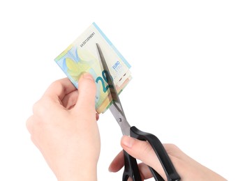 Photo of Woman cutting euro banknotes on white background, closeup