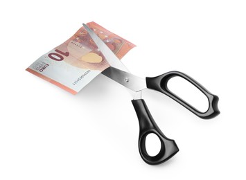 Photo of Scissors with euro banknote isolated on white