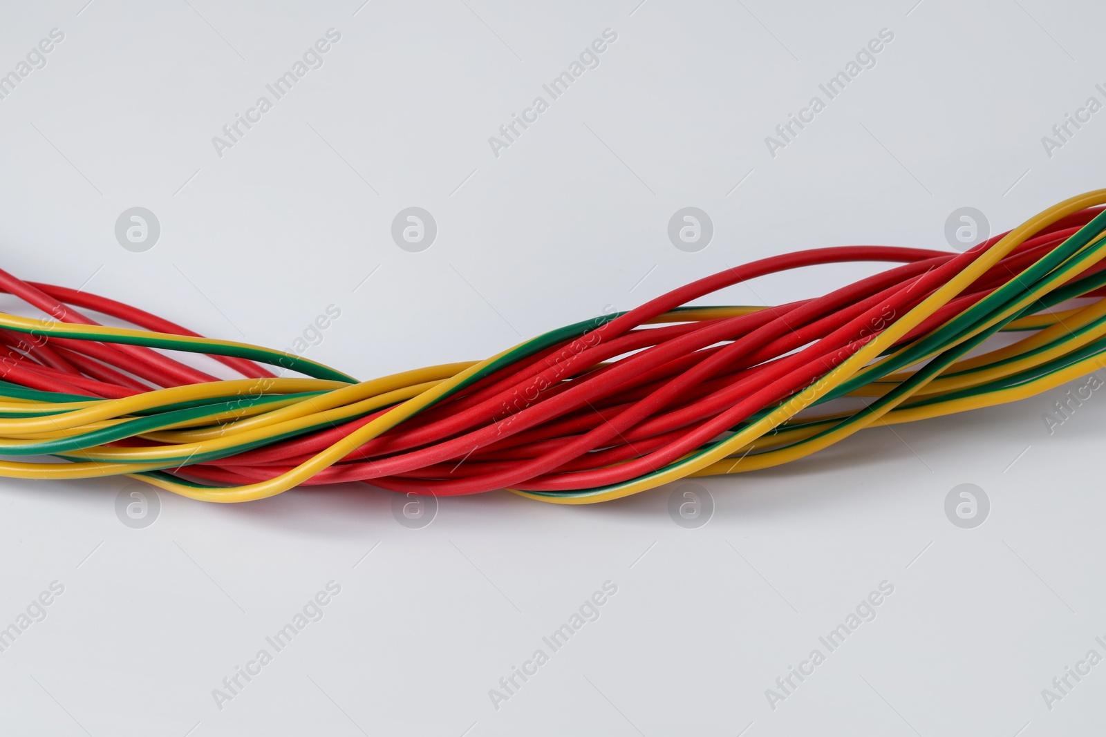 Photo of Many colorful electrical wires isolated on white