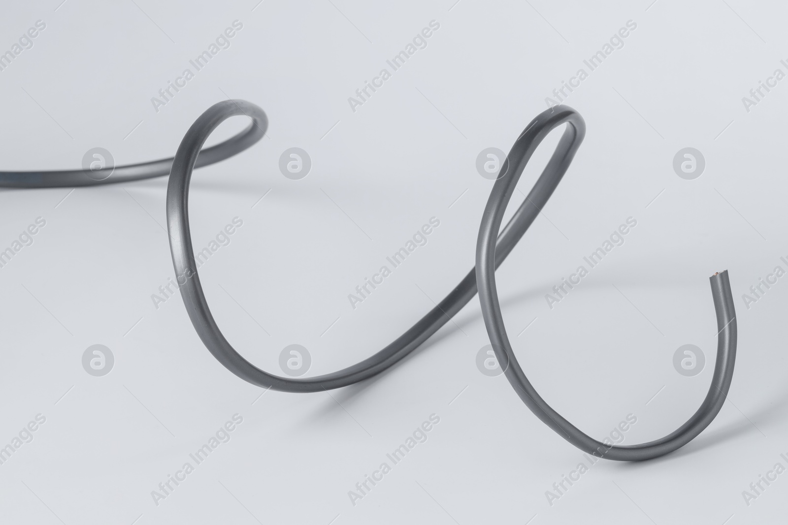 Photo of One grey electrical wire isolated on white